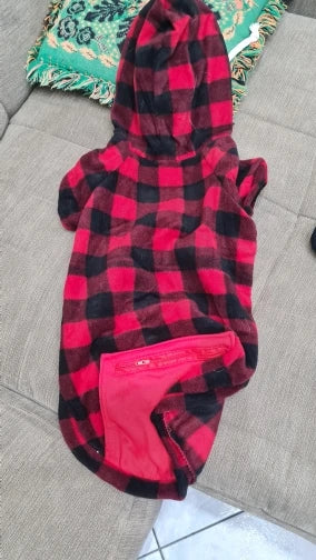 Red and black checkered hoodie with pink lining on a gray surface