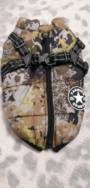 Camouflage-patterned dog coat with a visible brand logo on