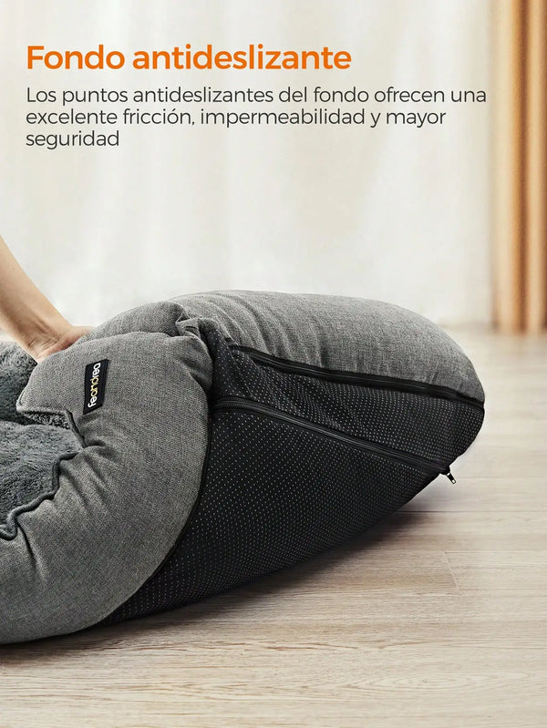 Gray pet bed with anti-slip bottom on a wooden floor, featuring a brand logo.

